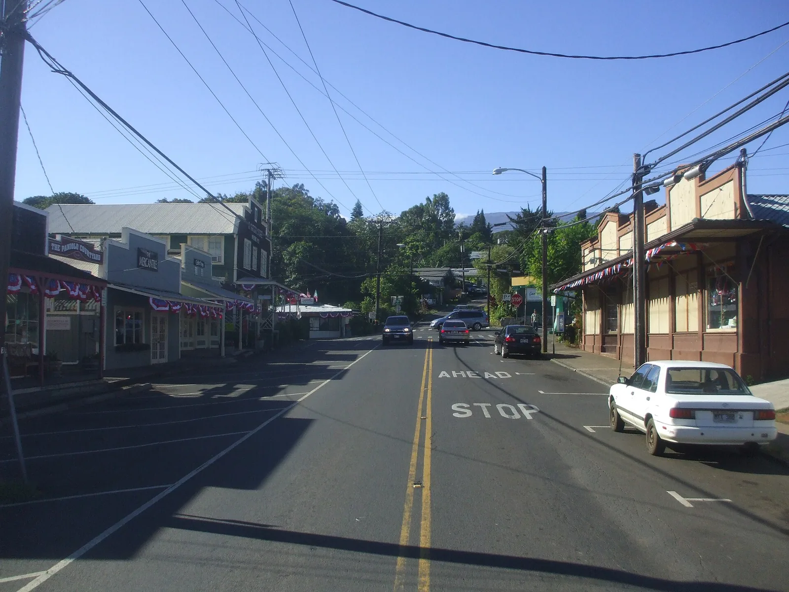 Makawao town main street with historic plantation-era storefronts and Haleakala behind
